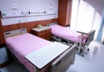 Empty patient room with beds